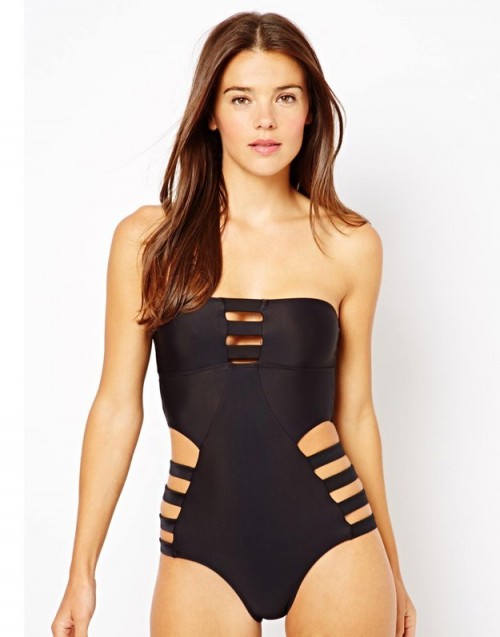 a black strapless one piece swimsuit with small cutouts is a sexy and cool idea for a pool party