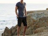 a grey tee, black shorts, grey sneakers for a relaxed and sporty summer holiday look