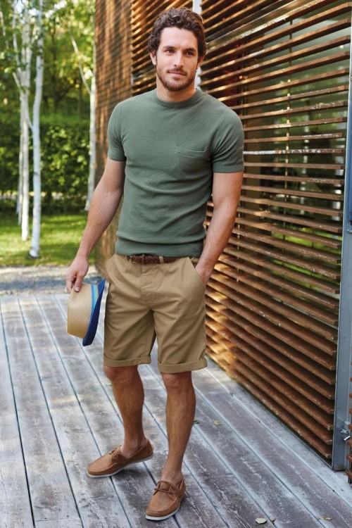 a green tee, khaki shorts, a hat and tan leather slipons for a summer holiday