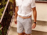 a white short sleeve shirt, striped shorts, grey sneakers for a relaxed and casual holiday