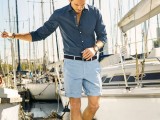a navy long sleeve shirt, blue shorts and grey moccasins for a stylish and elegant seaside look