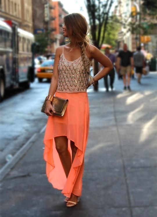 An embellished spaghetti strap top, a coral asymmetric maxi skirt, nude shoes and a metallic clutch