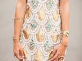 a sleeveless mini gold scallop dress with green touches is a chic piece for a modern party