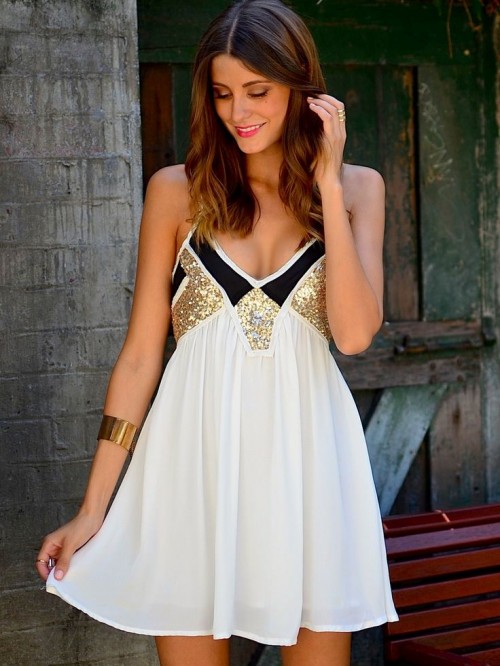 an A-line white, black and gold sequin mini dress with spaghetti straps is a cool piece for any party