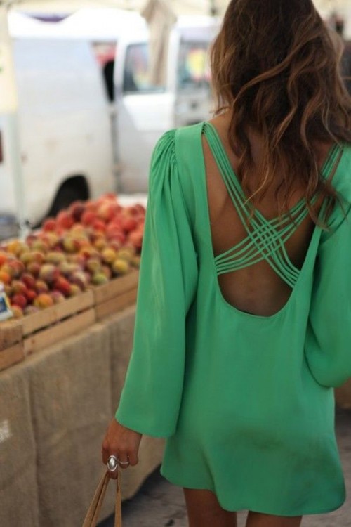 an apple green mini dress with an open back and criss cross straps is all you need for a chic look