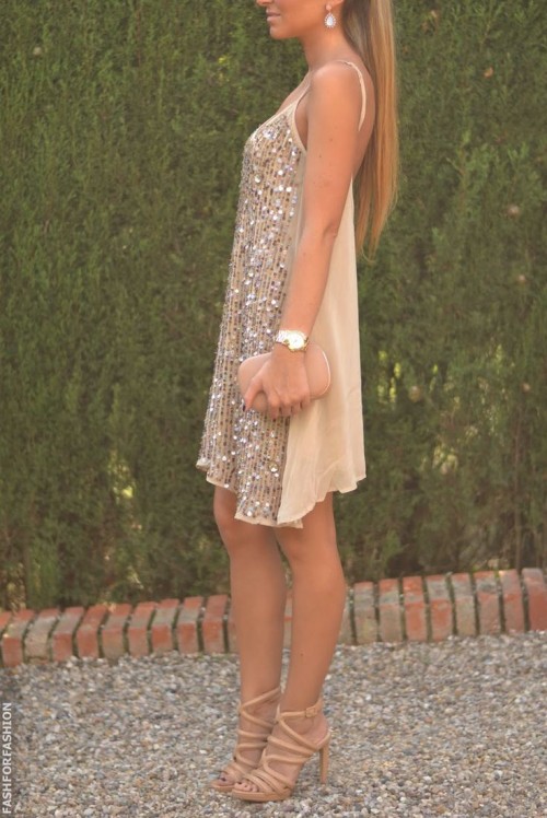 a tan mini dress with a fully embellished front, a bluch clutch and bluch heels for a bold party look