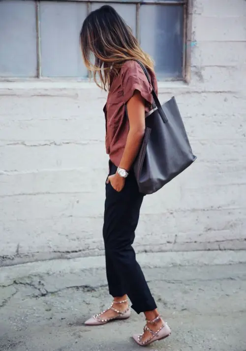 a minimalist look with black pants, a dusty pink button down, blush spiked flats and a black tote