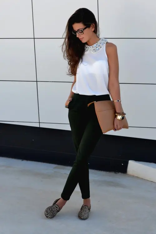 a simple and chic outfit with green pants, a white sleeveless top with an embellished collar, leopard flats and a brown clutch