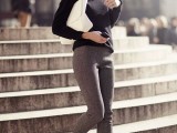 grey skinny pants, a black turtleneck, a white clutch and black flats for a minimalist work outfit
