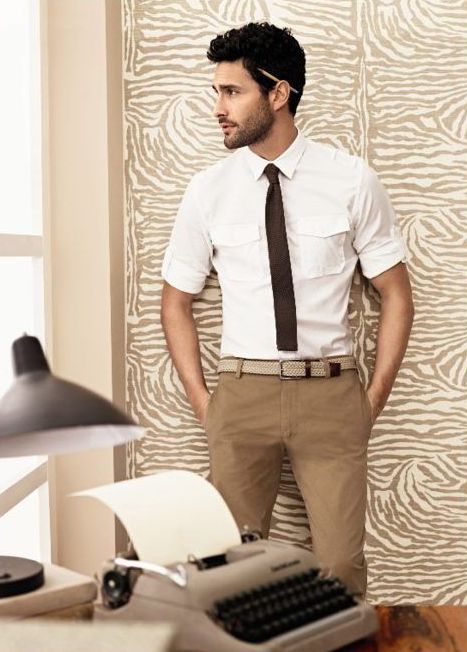 tan pants, a white shirt with rolled up sleeves and a brown tie for an everyday work look