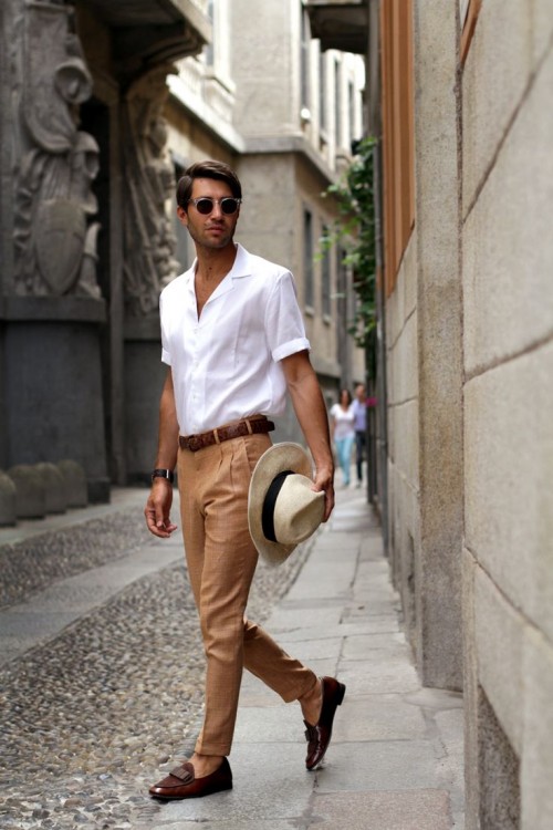 tan linen pants, a white shirt with short sleeves, brown moccasins and a white hat for a hot summer workday
