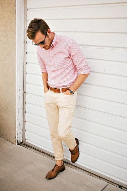 a pink striped shirt with cuffed sleeves, neutral pants, brown shoes for a light summer work look