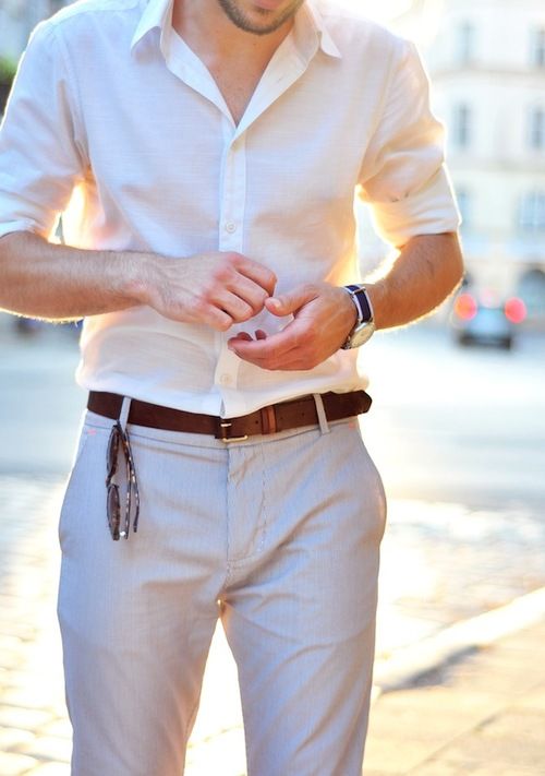a summer work look with a white shirt with cuffed sleeves and grey pants plus a brown belt is an easy and cool combo