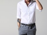 a creative work look with long grey shorts, a white shirt with short sleeves, a neck tie and a statement watch