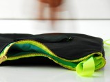 leather clutch with a neon zipper