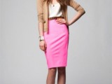 a neutral top, a playful hot pink pencil knee skirt, a camel cardigan, orange shoes that add color and boldness