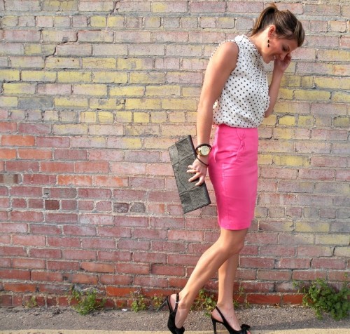 a sleeveless polka dot top, a pink pencil skirt, a black clutch and black shoes create a bright and very girlish look
