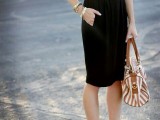 a lace sleeveless top, a black knee skirt and tan shoes to show off your legs and a tan plus cream bag